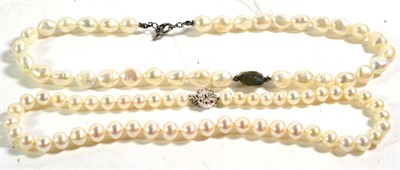 Lot 396 - A cultured pearl necklace with a central labradorite stone, length 46cm; and another cultured pearl