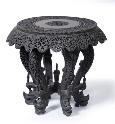 Lot 1632 - An Anglo-Indian Bombay Carved Hardwood Side Table, circa 1900, the circular top and foliate...