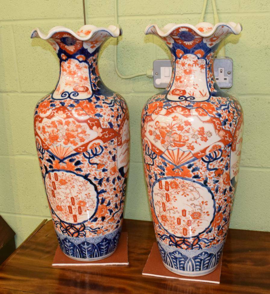 Lot 450 - A pair of large Japanese Imari baluster vases with frilled everted rims, early 20th century