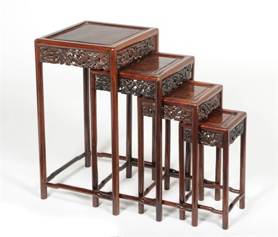 Lot 1635 - A Quartetto Nest of Chinese Padouk Wood Tables, circa 1900, each of square moulded form with carved