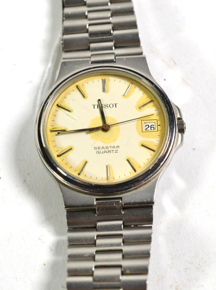 Lot 467 - A stainless steel calendar centre seconds quartz wristwatch, signed Tissot, model: Seastar,...