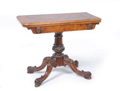 Lot 1642 - A Victorian Figured Walnut Foldover Card Table, 3rd quarter 19th century, the interior with...