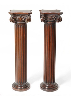 Lot 1650 - A Pair of Carved Mahogany Columns, the concave platforms above acanthus leaf scrolling...