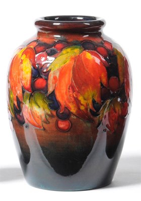 Lot 1657 - A William Moorcroft "Leaf and Berry" Flambe Vase, impressed factory mark with facsimile...