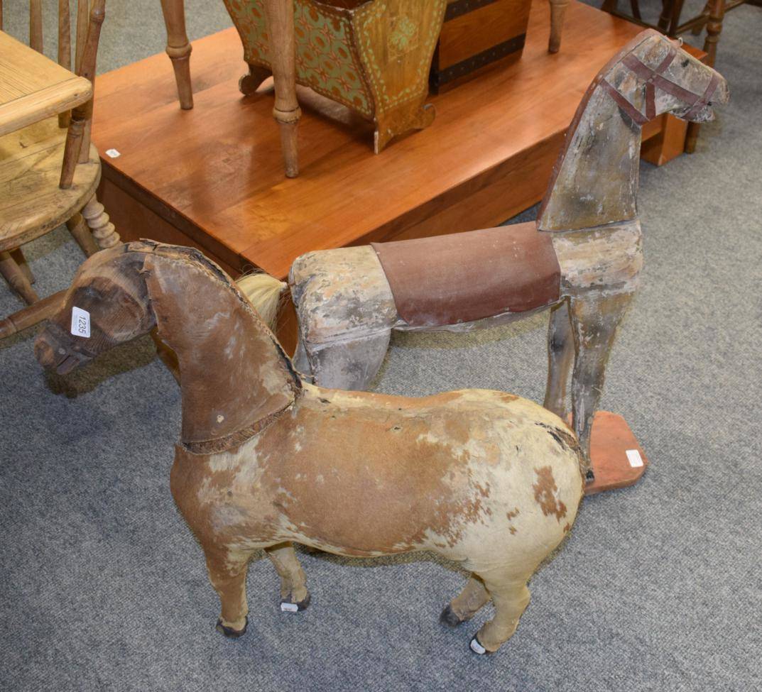 Lot 1235 - Late 19th century hide mounted straw filled horse with carved wooden head and hooves; grey...