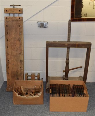 Lot 1240 - A large wooden book press; wooden work bench with clamps; stoneware bottle; treen pie moulds;...