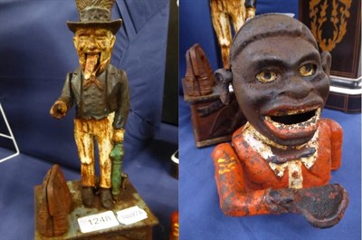 Lot 1248 - ~ A jolly money bank with moving arm and a painted metal American figural money box (2)