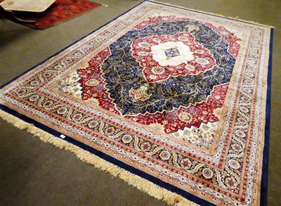 Lot 1259 - A machine made Sarook Kashan silk rug, the central floral medallion within conforming narrow...