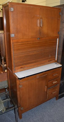 Lot 1268 - A 1950s Easiwork tambour front kitchen cabinet with tambour door and enamelled work surface,...