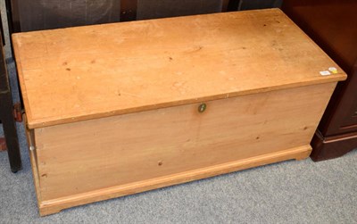 Lot 1281 - A Victorian pine trunk, with hinged lid and enclosing a candle box, on moulded base with...