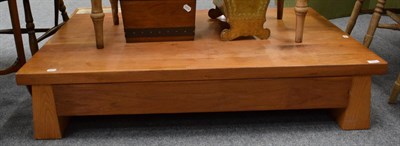 Lot 1284 - A solid wood coffee table with drawer