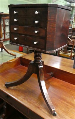 Lot 1328 - A 19th century mahogany work table with two dummy drawers above two functional drawers, raised on a