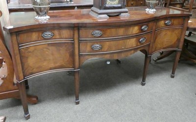 Lot 1338 - Christopher Pratt, a reproduction mahogany serpentine shaped sideboard, 197cm wide