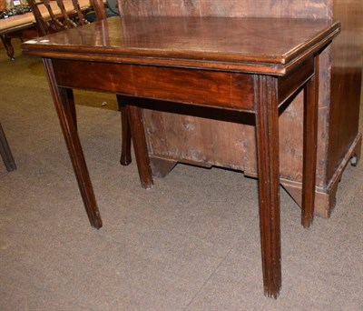 Lot 1342 - A Georgian mahogany fold over tea table