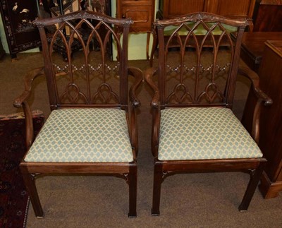 Lot 1343 - A pair of late 19th/early 20th century mahogany open arm chairs