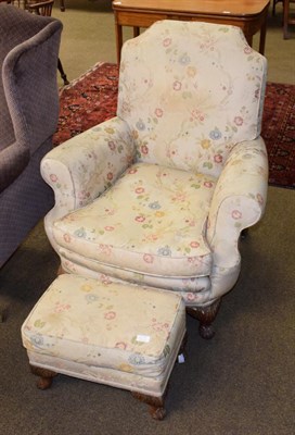 Lot 1349 - A 1950s Epstein armchair upholstered in floral fabric with matching footstool