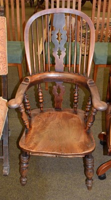 Lot 1361 - A 19th century elm Windsor armchair