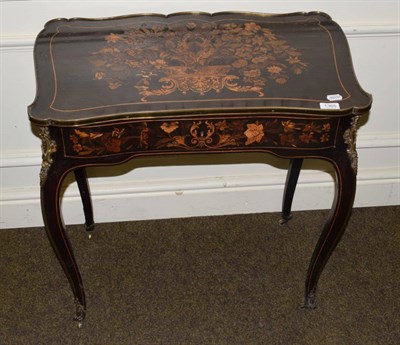 Lot 1365 - A late 19th century French marquetry writing table, in Louis XV style, the serpentine shaped...