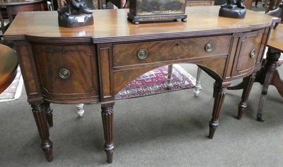 Lot 1368 - Early 19th century mahogany sideboard with a central frieze drawer and cupboard doors, raised...