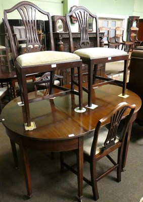 Lot 1373 - A George III mahogany D-end table and four Georgian style mahogany chairs