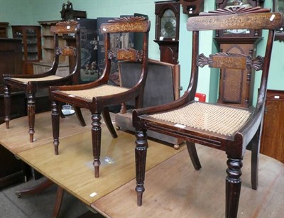 Lot 1383 - A set of three 19th century marquetry inlaid rosewood cane seated chairs