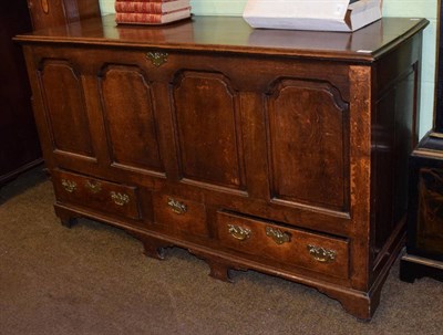 Lot 1403 - A George III panelled oak mule chest