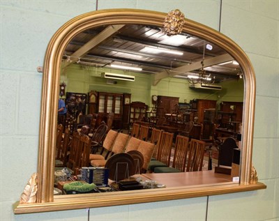 Lot 1404 - A reproduction gilt overmantel mirror