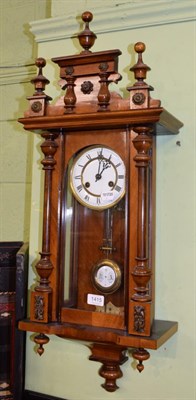 Lot 1415 - A walnut veneered Vienna type striking wall clock