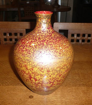 Lot 1685 - A Pilkington's Royal Lancastrian Lustre Vase, covered in a mottled red, orange and lustre...