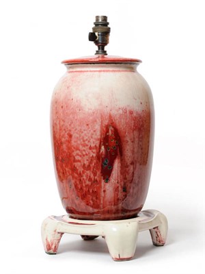 Lot 1687 - A Ruskin Pottery High Fired Stoneware Lamp and Stand, covered with a red glaze with speckled green