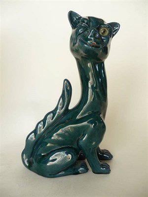 Lot 1695 - A Watcombe Pottery Cat, modelled seated and winking, with single inset glass eye, long...