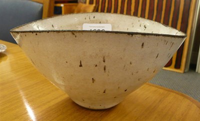 Lot 1696 - Lucie Rie (1902-1995): A Stoneware Bowl, of elliptical form, pitted oatmeal glaze and bronze...