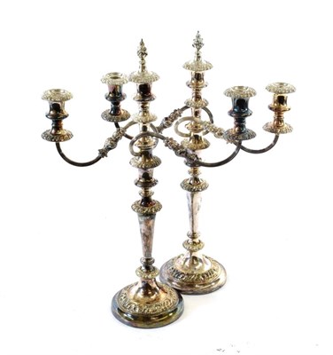 Lot 4 - A Pair of Silver-Plated Three-Light Candelabra, 19th Century, on circular base with fruiting...