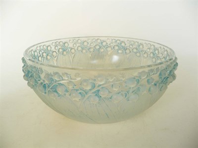 Lot 1711 - A Rene Lalique "Muguet" Frosted and Blue Stained Glass Bowl, No.417, moulded with lily of the...