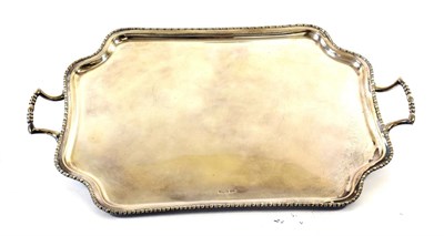Lot 84 - A George V Silver Tray, by Atkin Bros., Sheffield, 1910, shaped oblong and with beaded rim, on four