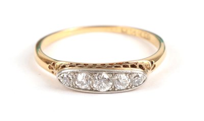 Lot 132 - A Diamond Five Stone Ring, the graduated old cut diamonds in white claws within a white lozenge...