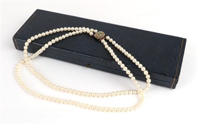 Lot 137 - A Cultured Pearl Double Row Necklace with Mourning Clasp, the part knotted strings of pearls to...