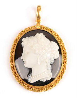 Lot 142 - A Victorian Agate Cameo Pendant, depicting a portrait of a lady, in a rope effect frame,...
