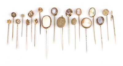 Lot 150 - Nineteen Stick Pins, including a pen nib example, cased; ten shell, agate and lava cameo...