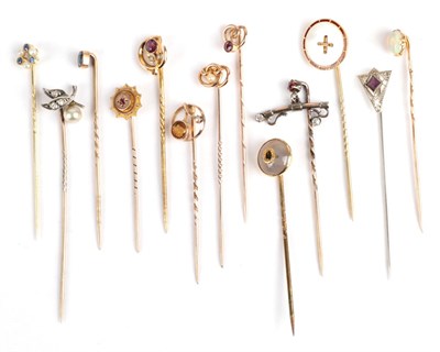 Lot 152 - Thirteen Stick Pins; including a sapphire and seed pearl example in a case; an opal example...