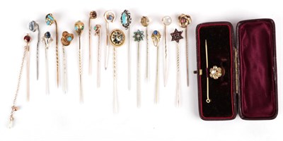 Lot 161 - Eighteen Stick Pins; including a garnet and houndstooth pearl example, a carved and turquoise inset