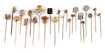 Lot 163 - Twenty-Three Stick Pins; including a hexagonal citrine set pin, cased, a thistle motif, a seal...