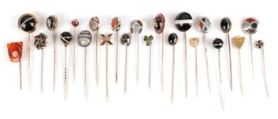Lot 164 - Twenty-Three Stick Pins; including a carbuncle garnet and seed pearl atop a banded agate...