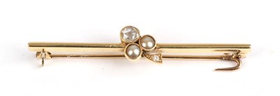 Lot 167 - A Diamond and Pearl Bar Brooch, circa 1910, a trefoil set with a rose cut diamonds and split pearls