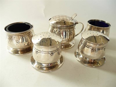 Lot 1724 - A Liberty and Co. Silver Five Piece Condiment Set, of bellied form on a spreading foot, with...