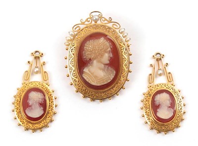 Lot 191 - A Cameo and Pearl Brooch, measures 3.2cm by 4.4cm, and A Pair of Earrings, en suite (without...