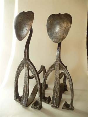 Lot 1728 - A Pair of Art Nouveau Wrought-Iron Andirons, with heart finials on textured scrolling supports,...