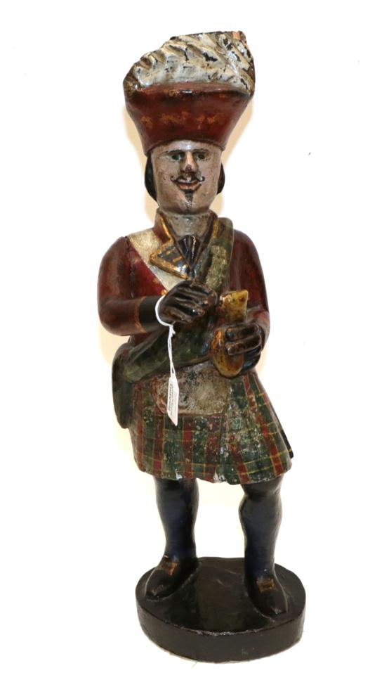Lot 331 - A Carved and Painted Wood Tobacconist Advertising Figure, modelled as a Highlander in...