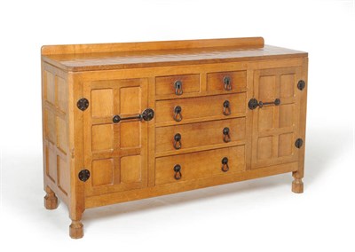 Lot 1743 - A Robert "Mouseman" Thompson Oak 5' Sideboard, with raised upstand, the moulded top over two...