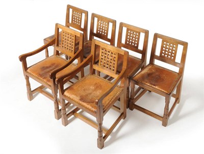 Lot 1746 - A Set of Six (4+2) Robert "Mouseman" Thompson Oak Lattice-Back Dining Chairs, with cow hide...